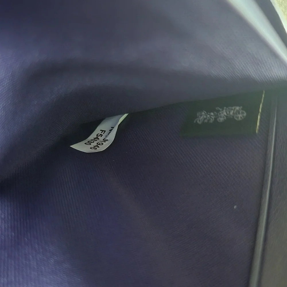 Coach Purple and Dark Brown
Signature PVC Leather Accordian
Zip Wallet - Picture 5 of 5